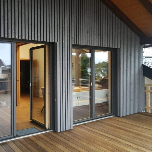 Wood facade Siberian larch slats chamfered in Nordic Gray 